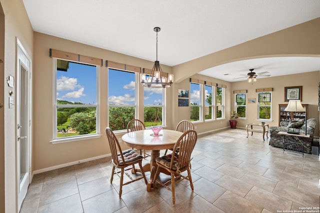 212 Vista Vw, Spring Branch, TX 78070 - dining room with arched walkways, baseboards, a chandelier, and a ceiling fan
