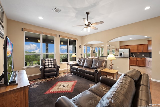 212 Vista Vw, Spring Branch, TX 78070 - living area with arched walkways, ceiling fan, light wood finished floors, baseboards, and recessed lighting