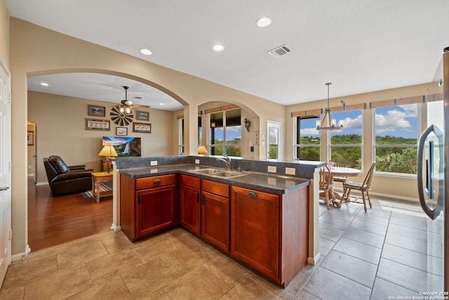 212 Vista Vw, Spring Branch, TX 78070 - kitchen featuring a sink, open floor plan, a chandelier, baseboards, and recessed lighting
