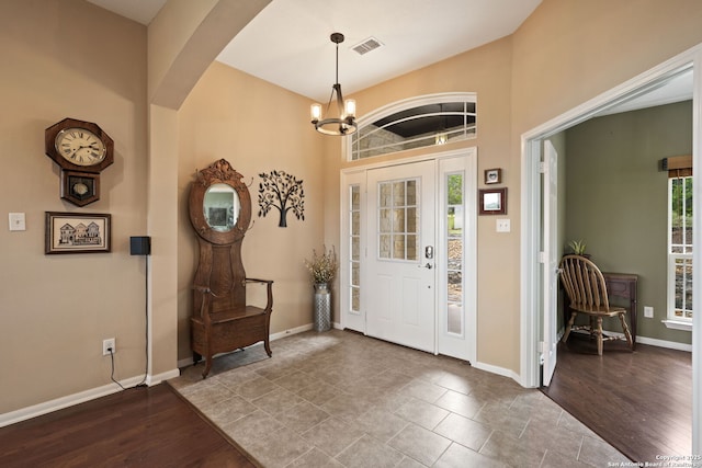 212 Vista Vw, Spring Branch, TX 78070 - entryway featuring a chandelier, baseboards, arched walkways, and wood finished floors