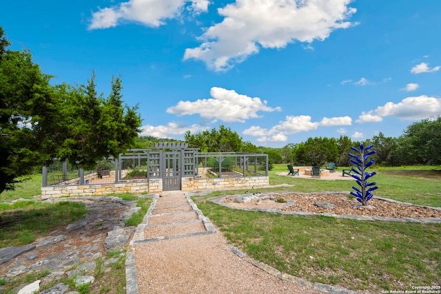 212 Vista Vw, Spring Branch, TX 78070 - view of green lawn featuring an outdoor fire pit and a patio