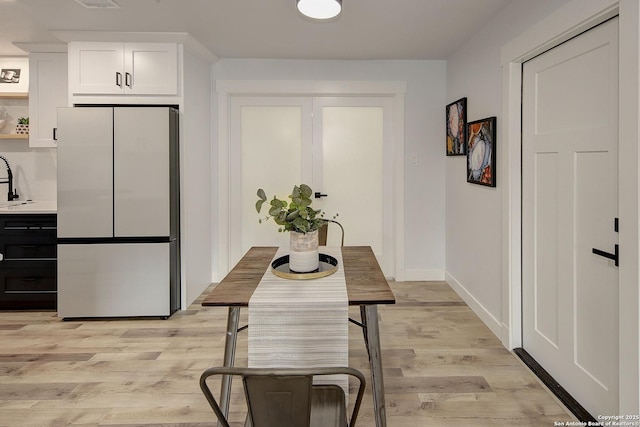2714 Floral Way, San Antonio, TX 78247 - dining room with light wood-type flooring and baseboards