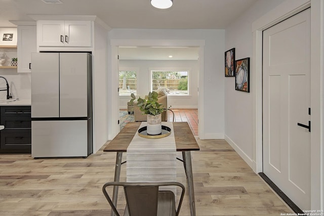 2714 Floral Way, San Antonio, TX 78247 - dining room featuring light wood finished floors and baseboards