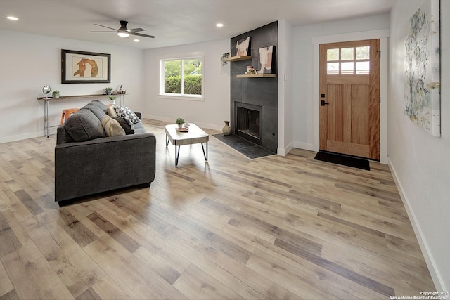 2714 Floral Way, San Antonio, TX 78247 - living room with ceiling fan, a fireplace, recessed lighting, healthy amount of natural light, and light wood-style floors