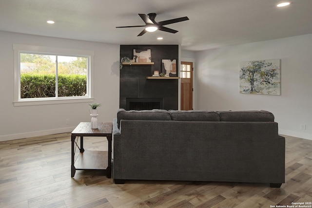 2714 Floral Way, San Antonio, TX 78247 - living area with a ceiling fan, a fireplace, recessed lighting, and wood finished floors
