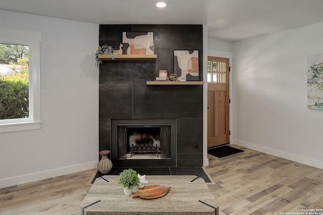 2714 Floral Way, San Antonio, TX 78247 - living room with plenty of natural light, wood finished floors, a large fireplace, and recessed lighting