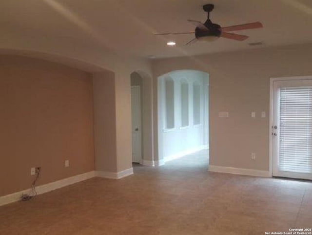 3607 Tea Rose Gln, San Antonio, TX 78259 - unfurnished room featuring arched walkways, ceiling fan, baseboards, and recessed lighting