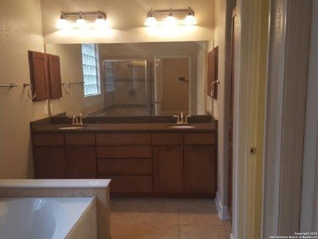 3607 Tea Rose Gln, San Antonio, TX 78259 - bathroom with double vanity, a stall shower, a bath, and tile patterned flooring