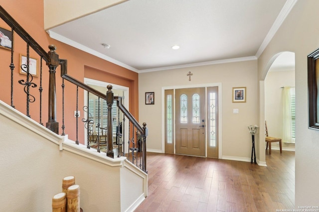 2929 Mccaskey Rdg, San Antonio, TX 78258 - entryway featuring arched walkways, ornamental molding, stairway, hardwood / wood-style floors, and baseboards