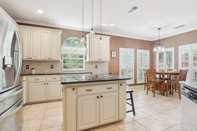 2929 Mccaskey Rdg, San Antonio, TX 78258 - kitchen featuring stainless steel appliances, tasteful backsplash, light tile patterned flooring, hanging light fixtures, and crown molding