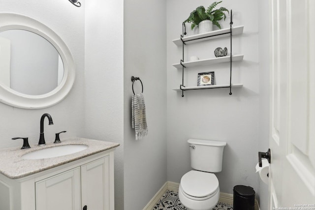2929 Mccaskey Rdg, San Antonio, TX 78258 - half bathroom featuring vanity, toilet, and baseboards