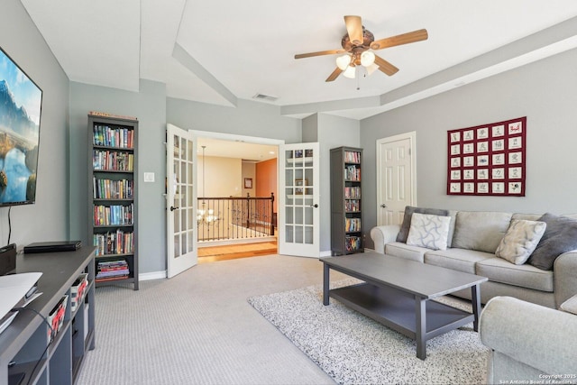2929 Mccaskey Rdg, San Antonio, TX 78258 - living room with french doors, ceiling fan, carpet floors, and baseboards