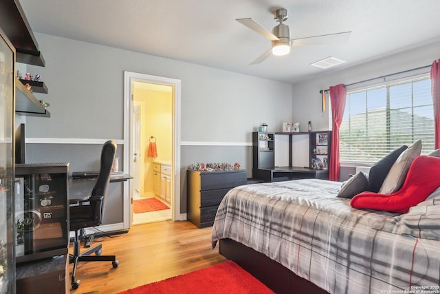 2929 Mccaskey Rdg, San Antonio, TX 78258 - bedroom featuring wood finished floors, connected bathroom, and ceiling fan