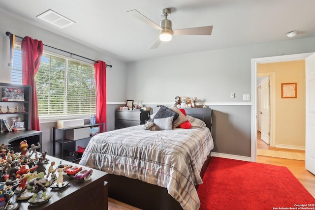 2929 Mccaskey Rdg, San Antonio, TX 78258 - bedroom featuring wood finished floors, baseboards, and a ceiling fan