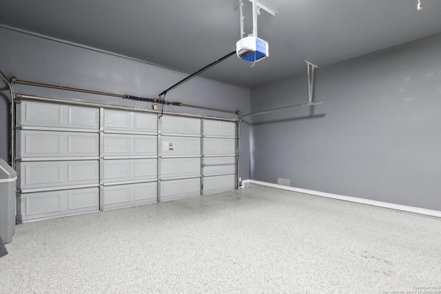 2929 Mccaskey Rdg, San Antonio, TX 78258 - garage featuring a garage door opener and baseboards