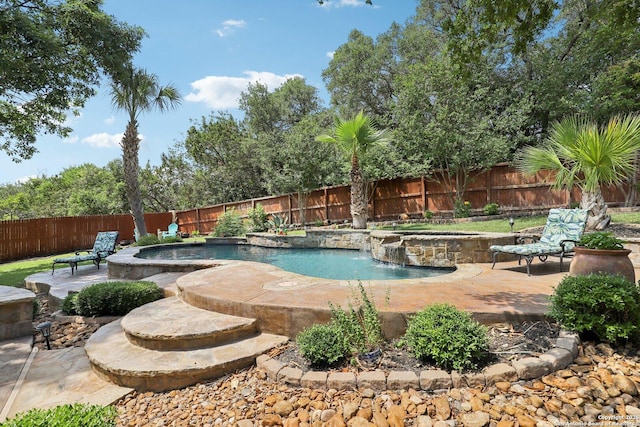 2929 Mccaskey Rdg, San Antonio, TX 78258 - view of swimming pool featuring an in-ground hot tub, a fenced backyard, a patio area, and an outdoor fire pit
