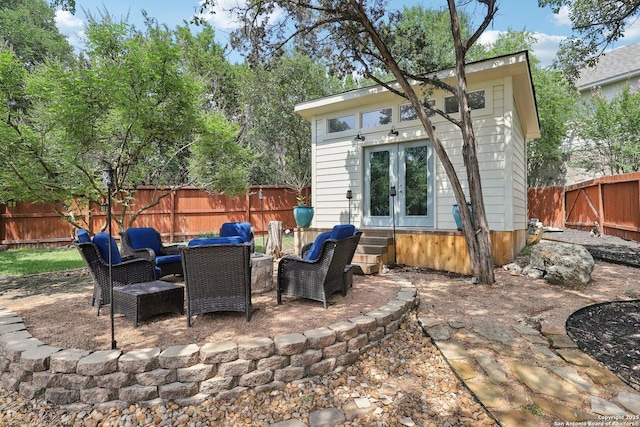 2929 Mccaskey Rdg, San Antonio, TX 78258 - fenced backyard with french doors, an outdoor structure, a patio area, and entry steps