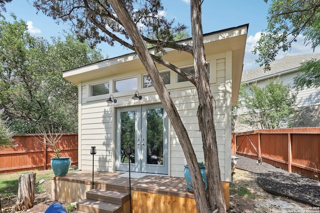 2929 Mccaskey Rdg, San Antonio, TX 78258 - back of house with french doors, a fenced backyard, a deck, and an outdoor structure