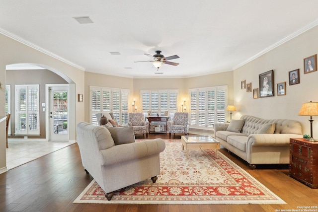2929 Mccaskey Rdg, San Antonio, TX 78258 - living room featuring arched walkways, ceiling fan, hardwood / wood-style floors, and ornamental molding