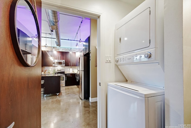 831 S Flores Unit 2212, San Antonio, TX 78204 - laundry room with stacked washer and clothes dryer