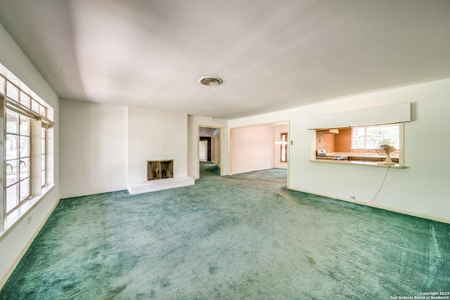 6514 W Ave, Castle Hills, TX 78213 - unfurnished living room featuring carpet and a fireplace
