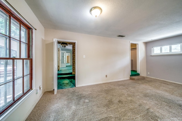 6514 W Ave, Castle Hills, TX 78213 - carpeted empty room featuring a textured ceiling and baseboards