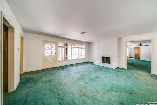 6514 W Ave, Castle Hills, TX 78213 - unfurnished living room with carpet flooring and a fireplace