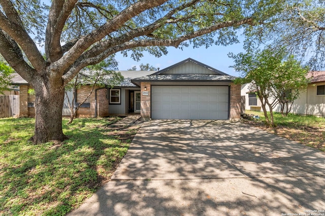 2866 Burning Rock, San Antonio, TX 78247 - ranch-style home with driveway, a garage, and brick siding