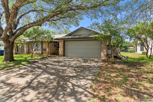 2866 Burning Rock, San Antonio, TX 78247 - ranch-style house with brick siding, concrete driveway, and a garage
