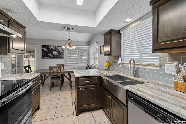 2866 Burning Rock, San Antonio, TX 78247 - kitchen with stainless steel appliances, a textured ceiling, a sink, dark brown cabinets, and recessed lighting