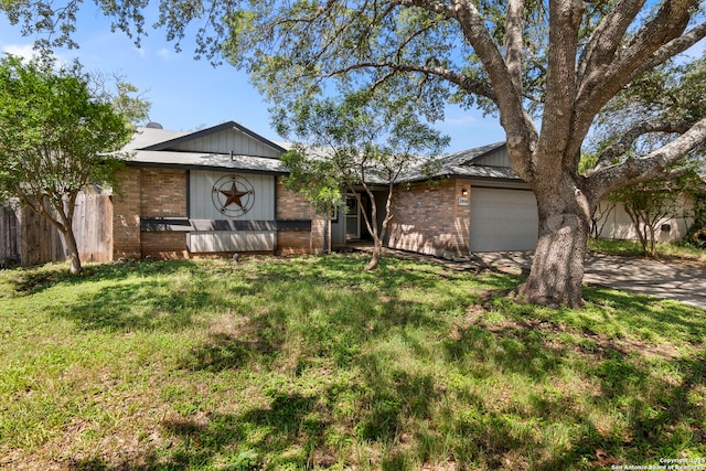 2866 Burning Rock, San Antonio, TX 78247 - view of front of property featuring an attached garage, brick siding, and concrete driveway