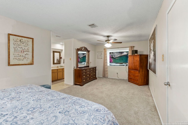 2866 Burning Rock, San Antonio, TX 78247 - bedroom featuring light carpet, a textured ceiling, a ceiling fan, ensuite bathroom, and baseboards