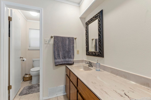 2866 Burning Rock, San Antonio, TX 78247 - bathroom with vanity, ornamental molding, toilet, and tile patterned flooring