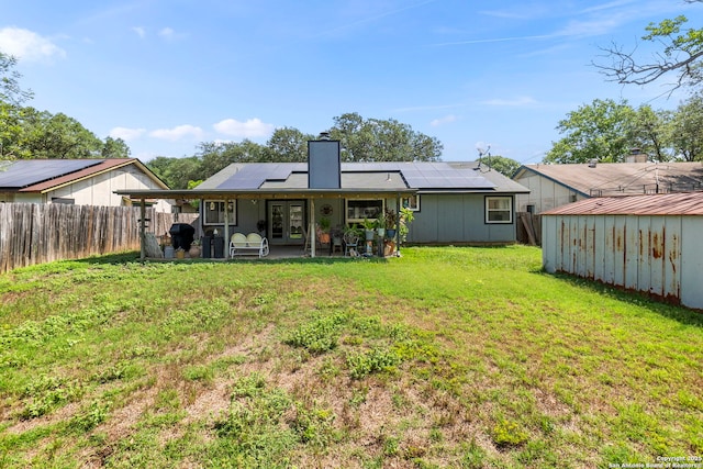 2866 Burning Rock, San Antonio, TX 78247 - rear view of property with french doors, roof mounted solar panels, a patio, and a chimney