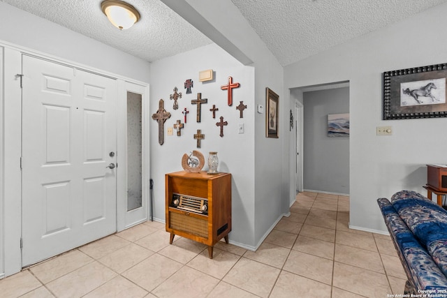 2866 Burning Rock, San Antonio, TX 78247 - entrance foyer with a textured ceiling, light tile patterned floors, and baseboards