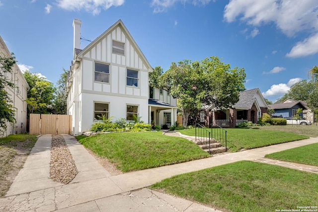 264 E Lullwood, San Antonio, TX 78212 - english style home with a gate, board and batten siding, and stucco siding