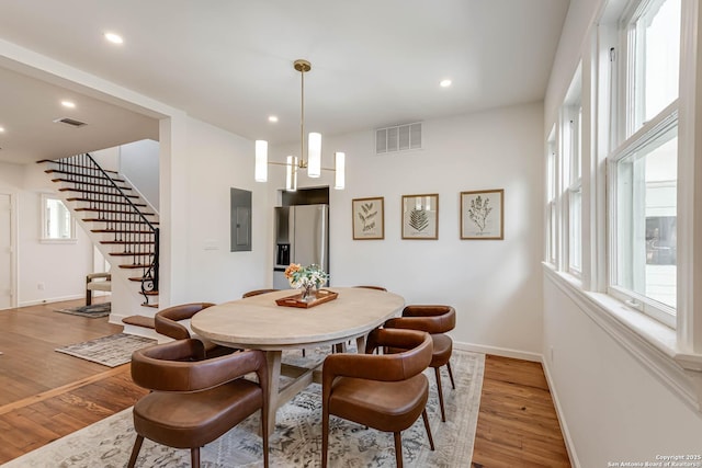 264 E Lullwood, San Antonio, TX 78212 - dining room featuring stairs, light wood finished floors, baseboards, recessed lighting, and electric panel