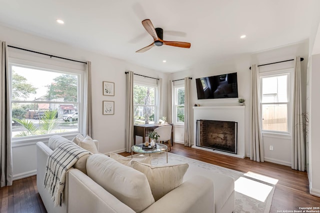 264 E Lullwood, San Antonio, TX 78212 - living area with wood finished floors, a fireplace, a ceiling fan, recessed lighting, and baseboards