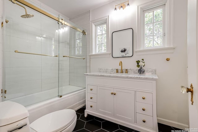 264 E Lullwood, San Antonio, TX 78212 - bathroom featuring toilet, bath / shower combo with glass door, vanity, and tile patterned floors