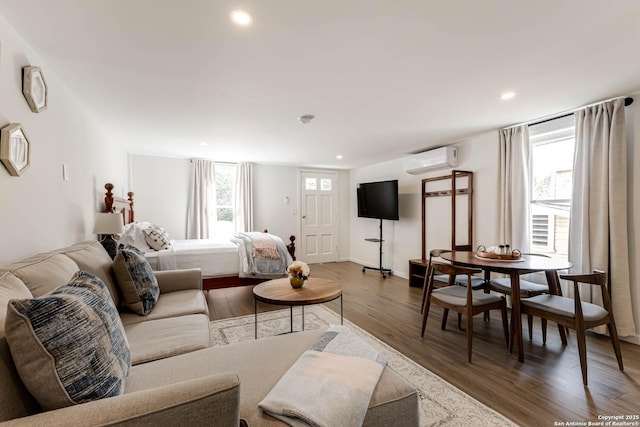 264 E Lullwood, San Antonio, TX 78212 - living area with a wall mounted AC, wood finished floors, and recessed lighting