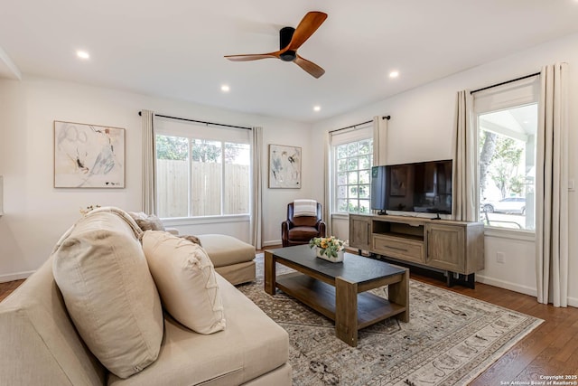 264 E Lullwood, San Antonio, TX 78212 - living room featuring wood finished floors, a ceiling fan, baseboards, and recessed lighting