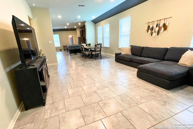 8339 Percheron Pass, San Antonio, TX 78254 - living room with healthy amount of natural light, light marble finish floors, and baseboards