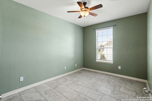 8339 Percheron Pass, San Antonio, TX 78254 - spare room with a ceiling fan, light marble finish flooring, baseboards, and a textured wall