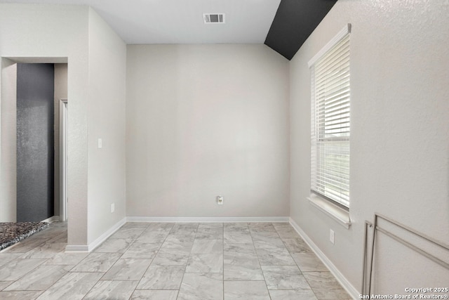 8339 Percheron Pass, San Antonio, TX 78254 - spare room with light marble finish floors, lofted ceiling, and baseboards
