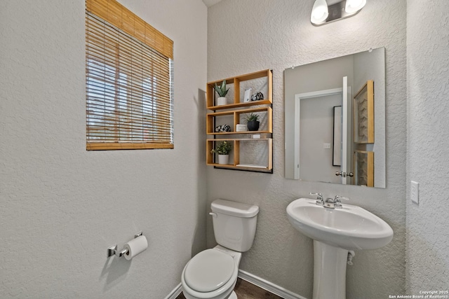 9302 Graze Land Dr, San Antonio, TX 78211 - bathroom featuring toilet and a textured wall