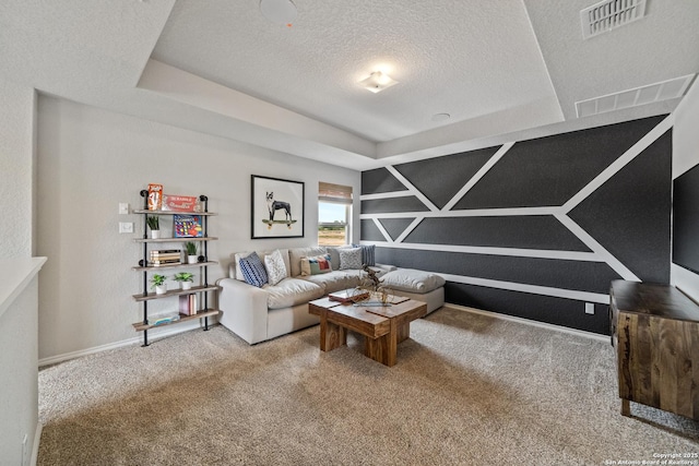 9302 Graze Land Dr, San Antonio, TX 78211 - carpeted living room featuring a tray ceiling, a textured ceiling, and baseboards