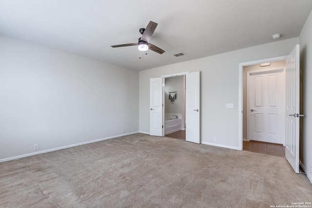 10907 Shoo Fly, San Antonio, TX 78245 - unfurnished bedroom featuring carpet floors, ensuite bathroom, and ceiling fan