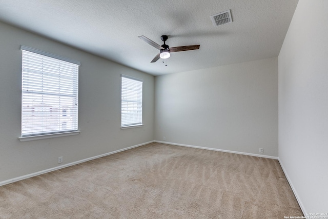 10907 Shoo Fly, San Antonio, TX 78245 - spare room with a ceiling fan, carpet, and a textured ceiling