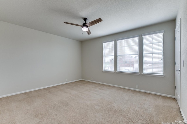 10907 Shoo Fly, San Antonio, TX 78245 - empty room with ceiling fan, light colored carpet, and a textured ceiling