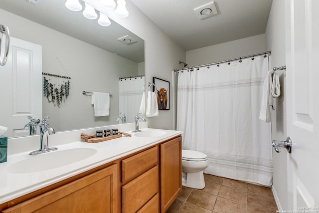 10907 Shoo Fly, San Antonio, TX 78245 - full bathroom with double vanity, tile patterned floors, and a shower with shower curtain